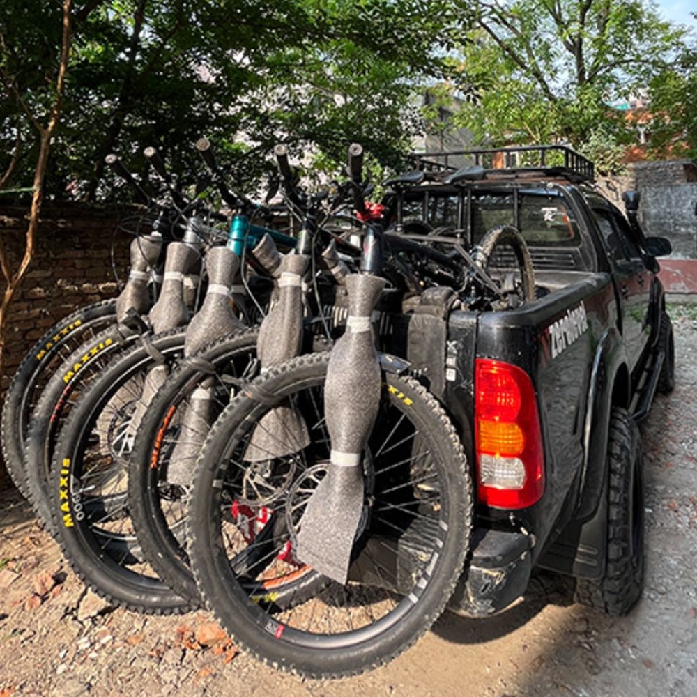 Truck loaded with bikes for pickup and drop-off service