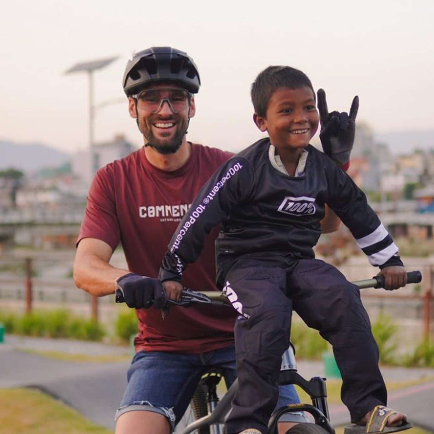 Professional rider Kilian Bron with a child on a mountain bike